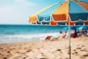 ai généré proche en haut image de une Jaune et bleu plage parapluie sur une Contexte de une plage avec Soleil chaises longues et bleu mer photo