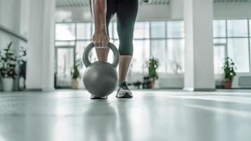 ai généré aptitude femme avec kettlebell dans moderne Gym photo