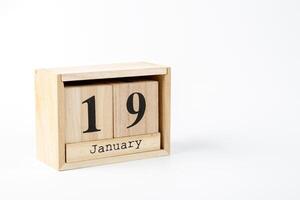 en bois calendrier janvier 19 sur une blanc Contexte photo