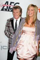 barre stewart épouse penny en arrivant à le pré-grammy fête honorer Clive Davis à le Beverly Hilton Hôtel dans Beverly collines, Californie sur février 7, 2009 photo