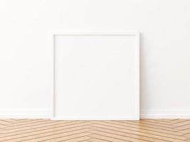 maquette de cadre carré blanc sur le plancher en bois. rendu 3D. photo