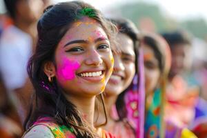 ai généré souriant Jeune Indien femmes célébrer Holi Festival photo