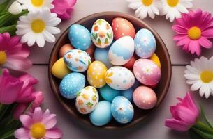 ai généré Pâques, coloré peint des œufs décoré avec ornements et motifs, rose printemps fleurs, marguerites, des œufs dans une osier nid, Haut voir, en bois Contexte photo
