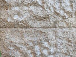 marron crème pierre mur texture lequel est d'habitude installée sur le des murs de Maisons ou luxe villas photo