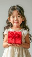 ai généré peu fille avec joyeux sourire en portant rouge cadeau boîte, vacances fête photo