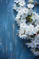 ai généré un l'automne image fabriqué avec blanc Cerise fleurs sur une bleu bois Contexte. photo