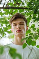 ai généré portrait de Jeune homme avec vert feuilles pour Naturel des produits publicité. attrayant détendu homme sur vert la nature Contexte photo