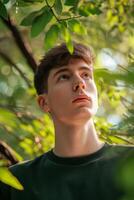 ai généré portrait de Jeune homme avec vert feuilles pour Naturel des produits publicité. attrayant détendu homme sur vert la nature Contexte photo