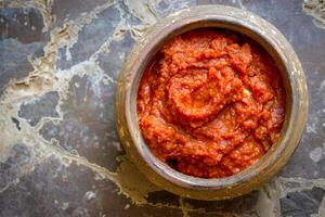 ai généré Harissa sauce, fabriqué de chaud rouge poivre, Ail et épices. Haut voir. ai créé. photo