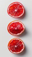 ai généré Trois rouge fruit tranches sur une blanc Contexte photo