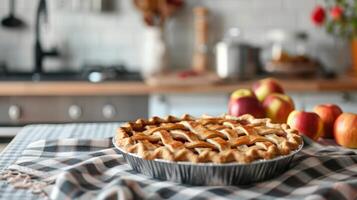 ai généré délicieux Pomme tarte des stands sur une à carreaux nappe de table contre une flou lumière cuisine Contexte photo