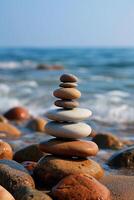 ai généré zen des pierres empilés dans parfait équilibre le long de une tranquille plage photo