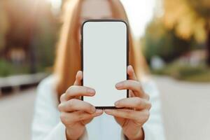 ai généré fermer, content magnifique femme montrant blanc téléphone intelligent, génératif ai photo