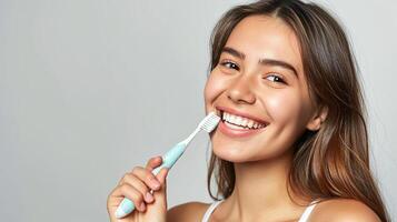 ai généré joyeux Jeune femme brosses sa en bonne santé les dents avec une brosse à dents photo