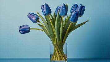 ai généré magnifique tulipe fleurs sur une bleu Contexte photo