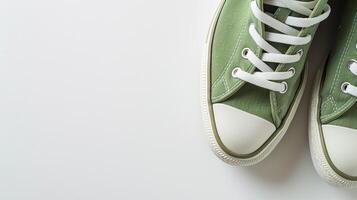 ai généré vert Toile des chaussures isolé sur plat blanc Contexte avec copie espace pour publicité. génératif ai photo