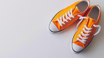 ai généré Orange Toile des chaussures isolé sur plat blanc Contexte avec copie espace pour publicité. génératif ai photo