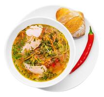 poulet soupe avec nouilles et des légumes dans blanc bol photo