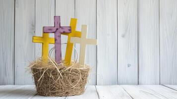 ai généré des croix niché dans une paille panier contre une blanc en bois arrière-plan, offre une paisible et contemplatif scène avec les options pour des croix dans blanc, jaune, ou violet teintes. photo