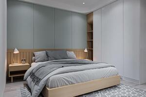une chambre dans une luxe loger, lisse et grande taille lit avec le lampe sur des deux cotés console tableau. photo