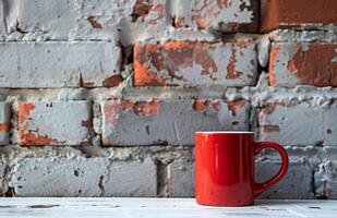 ai généré rouge café tasse sur blanc table contre une brique mur photo