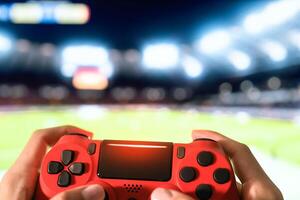 une la personne en portant une vidéo Jeu manette dans de face de une football champ photo