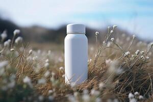 ai généré nettoyer blanc minimaliste thermos maquette. fermer de une thermo ballon avec une endroit pour l'image de marque dans une champ dans la nature photo