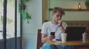 ai généré numérique nomade Jeune homme en utilisant téléphone intelligent et portable à le café, travail éloigné et La technologie concept photo