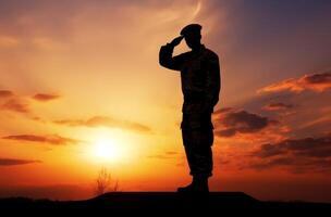 ai généré silhouette de une soldat salue à le coucher du soleil photo