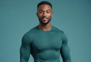 ai généré une en forme Masculin athlète dans une vert des sports chemise des stands contre une sarcelle Contexte. le sien posture et tenue suggérer un actif mode de vie. photo