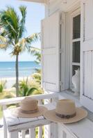 ai généré deux paille Chapeaux sur une balcon surplombant une tropical plage photo
