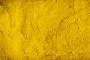 fond de texture de mur en béton jaune photo