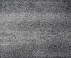 Contexte texture de rugueux noir tapis. photo