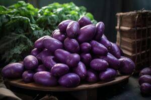 ai généré vibrant violet sucré patates sur en bois tableau. produire ai photo