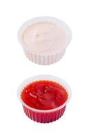 bol de acide crème et ketchup sur blanc Contexte photo
