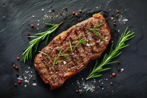 ai généré rôti du boeuf steak sur foncé pierre Contexte avec Romarin herbes. Haut voir, génératif ai photo