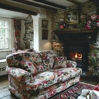 ai généré traditionnel Anglais chalet vivant pièce avec floral motifs et confortable cheminée photo