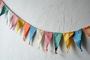 ai généré de fête guirlande de multicolore en tissu Triangles sur une blanc mur avec espace pour texte. vacances concept. généré par artificiel intelligence. photo