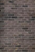 Urbain marron brique mur texture dans vieilli construction, grunge pierre modèle sur solide surface, abstrait vieux bâtiment bloquer Contexte photo