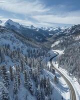 ai généré aérien vue de enroulement route dans montagnes avec neige photo