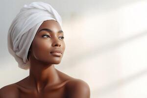 ai généré spa, femelle beauté, peau se soucier concept. jolie afro américain femme avec une serviette sur tête sur une blanc Contexte avec ombres à la recherche loin, copie espace photo