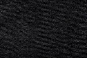 Contexte avec une texture de foncé noir jeans. photo