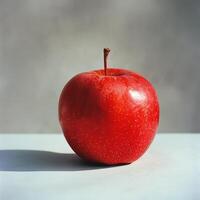 ai généré rouge Pomme sur blanc table photo