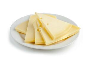 ai généré fromage tranches sur blanc assiette isolé sur blanc Contexte. photo