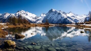 ai généré clair comme de l'eau de roche Lac avec neige plafonné montagnes dans scénique vue photo