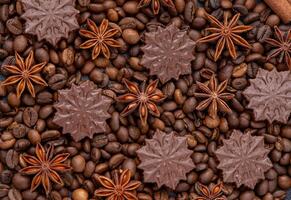 nourriture Contexte. café haricots, anis étoiles et Chocolat des sucreries. photo
