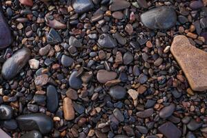 texture de humide brillant petit mer des pierres photo