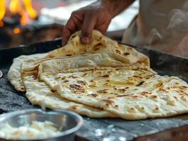 ai généré Naan pain fabrication duveteux et de beurre photo