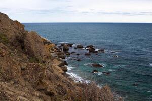 mer vague lavages Jaune plage de galets photo