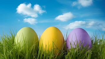 ai généré Pâques des œufs niché dans herbe en dessous de une vibrant bleu ciel photo